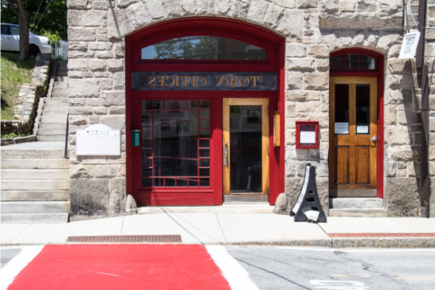 Entrance to a town office building with red crosswalk